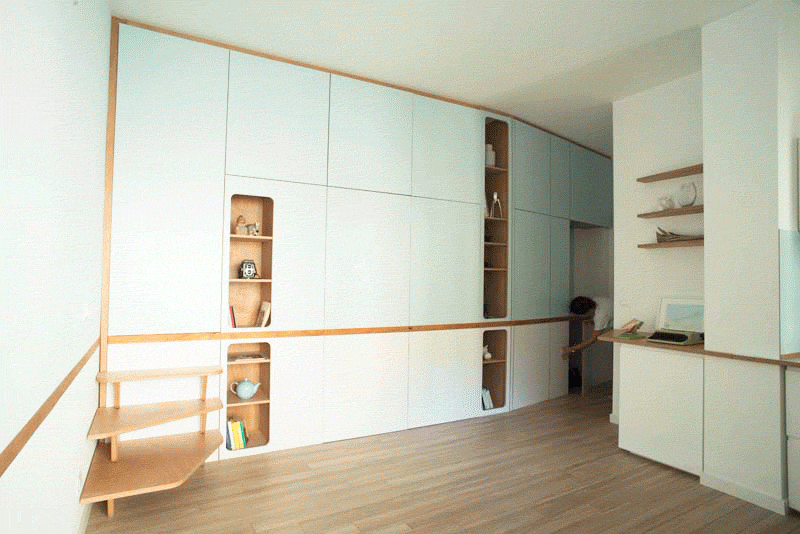 A Custom Wall Unit In This Small Apartment Makes It Possible