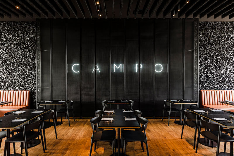 The CAMPO Modern Grill Was Designed With Hand-Laid Black Pebble Accent Walls