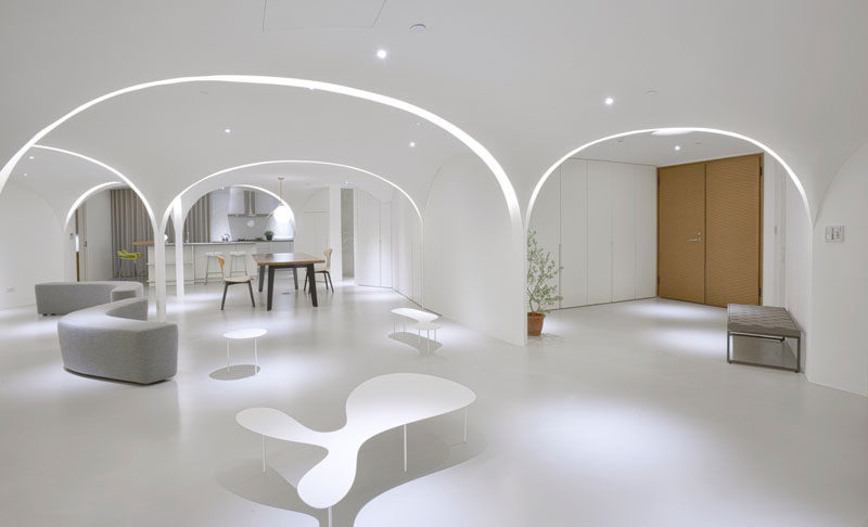 Very Studio | Che Wang Architects have designed the interior of a modern white apartment that features arches that have curved lighting that runs within them. #InteriorDesign #Lighting #Archway