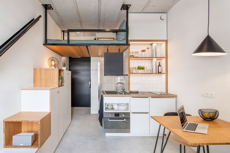 This Small Apartment Has A Loft Bed Suspended From The Ceiling