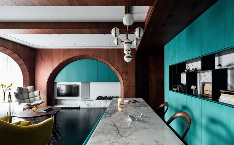Wood Arches And Turquoise Accents Are Featured Throughout This Apartment Interior