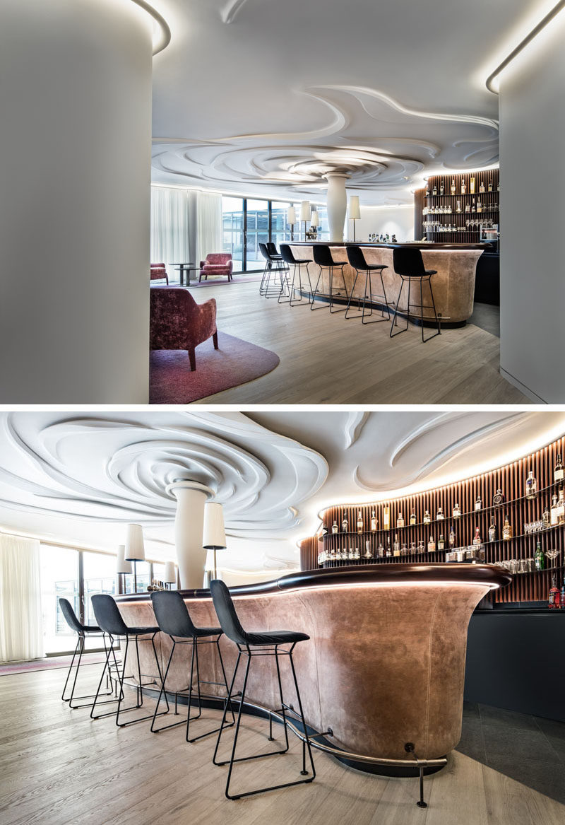 Nature was the inspiration in this modern bar and lounge area, and it has been represented through a 100-sq-m sculpted rose on the ceiling. #Ceiling #Sculpture #Bar
