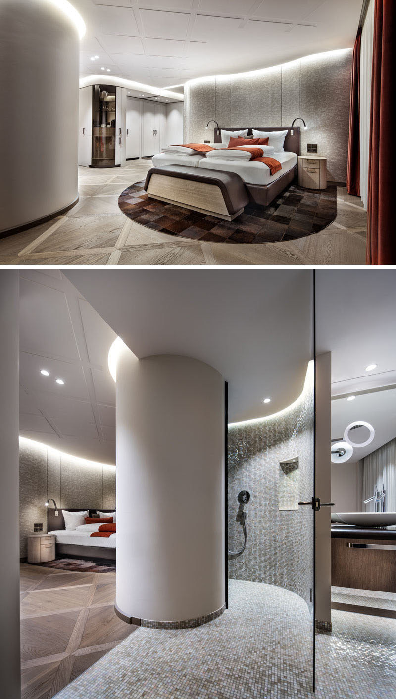 In this hotel room, the ceiling has a delicate square pattern, while the bathroom is tucked away behind a curved column. #HotelRoom #HotelDesign #HotelInterior