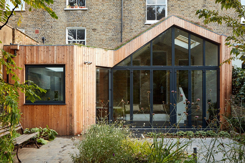 A Modern Wood Rear Extension Was Added To This Home In England