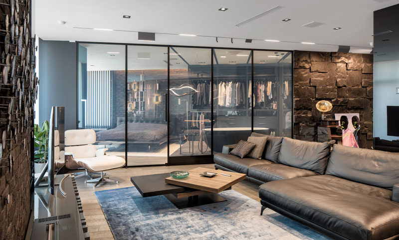 This modern apartment has a 'smart glass' wall that can transform the glass from being transparent to opaque. #SmartGlass #GlassWall #Apartment #interiorDesign