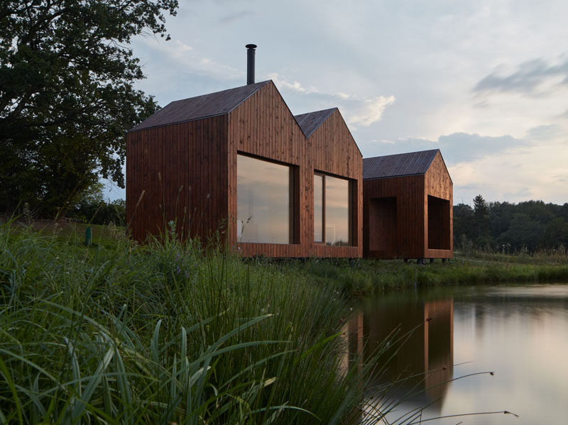 Atelier 111 have designed this small wood cottage that sits on the bank of a pond, and was inspired by traditional fisherman's cabins. #ModernCottage #ModernCabin #WoodCabin #Architecture