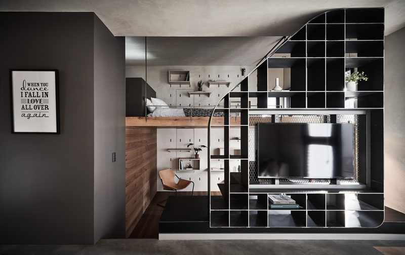 The Stairs In This Small Apartment Lead Up To A Loft Bedroom