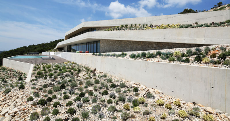 This House Almost Disappears As It's Designed To Blend Into The Landscape