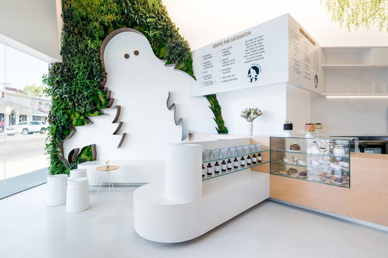 An 11 Foot Sasquatch Surrounded By A Green Wall Welcomes Customers To This Coffee Shop