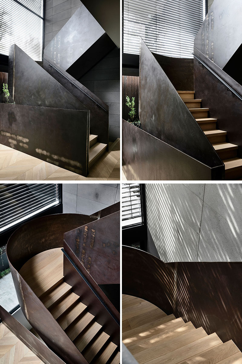 Modern steel and wood stairs that lead to the upper level of this house. #ModernSteelStairs #SteelAndWoodStairs #StairDesign