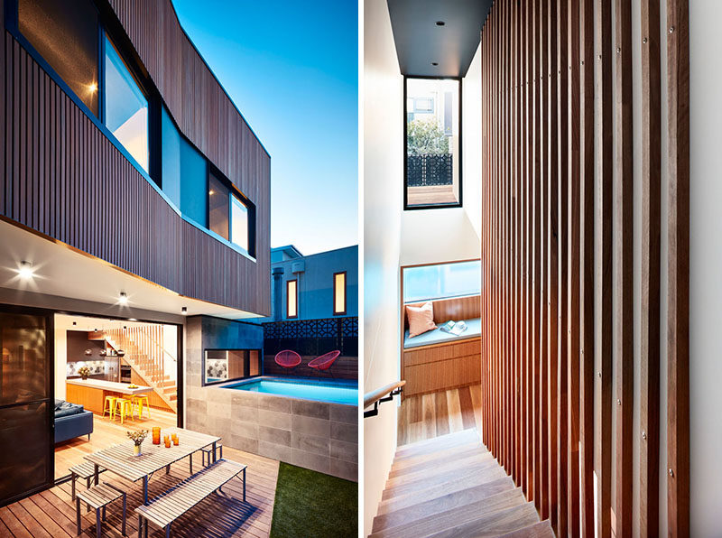 This modern house has a window seat at the bottom of the stairs that looks out to the pool, and the wood slats of the stairs continue up to the ceiling as a decorative wall feature. #ModernHouse #Stairs #WindowSeat