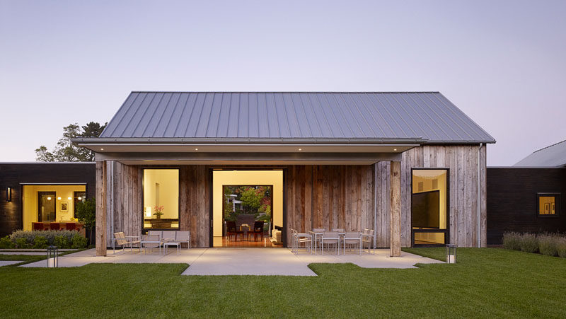 Walker Warner Architects have designed the Portola Valley Barn, a contemporary house in California, that features weathered wood siding and a tin roof. #Architecture #ModernHouse