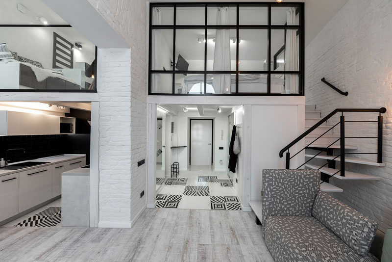 This Distinctly Black And White Apartment With A Mezzanine Level