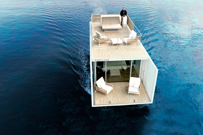 This Houseboat Was Designed With Vertical Slats That Allow Light In While Maintaining Privacy