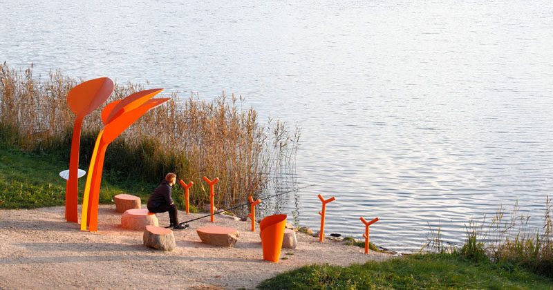 This Public Seating Beside A Lake In Latvia Provides A Place To Rest A Fishing Rod