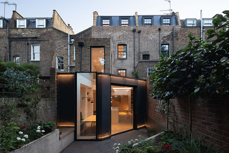 A Rear Extension With A Pivoting Glass Door Has Been Added To This London Home