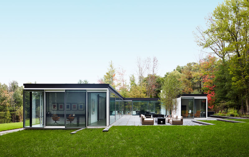 Jamie Drake and Caleb Anderson of Drake/Anderson have designed the interiors of a unique glass house in Ghent, New York. #GlassHouse #ModernArchitecture