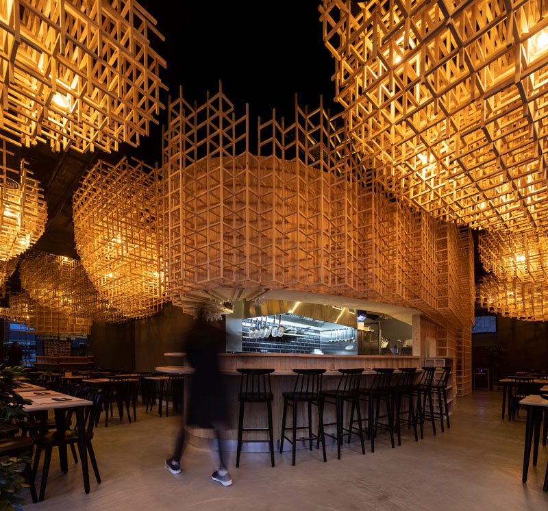 Large Sculptural Lights Create A Warm Atmosphere In This Ramen Restaurant