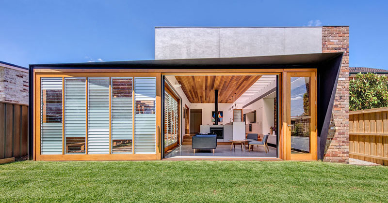 Oversized Sliding Doors On This House Connect The Living Room With