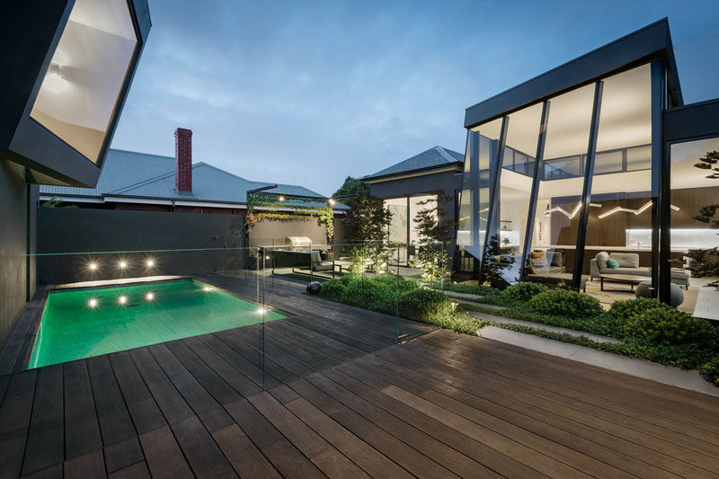 This Modern House Addition Showcases The Ceiling Height With Tall Windows