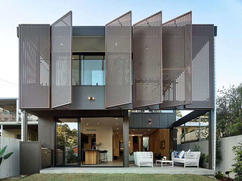 Large Metal Screens Provide Privacy For This New House