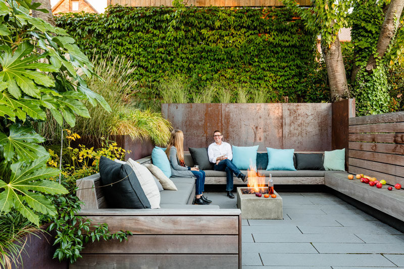 Landscaping Ideas - This sunken courtyard features custom hardwood screens, plate steel retaining walls, ipe wood benches, and handmade cushions by La Fabrique. #LandscapingIdeas #GardenIdeas #OutdoorSpace #Courtyard #OutdoorSeating #GardenIdeas