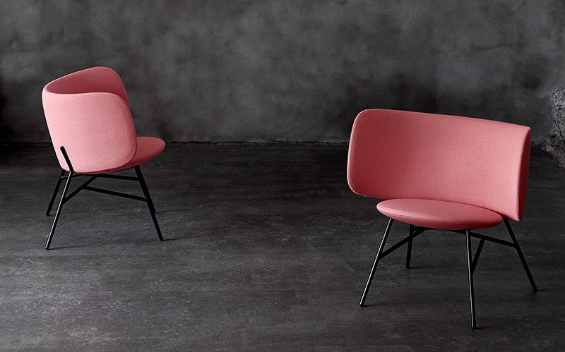 The Stella Lounge Chair Has A Curved Backrest That Creates A Cheerful Shape