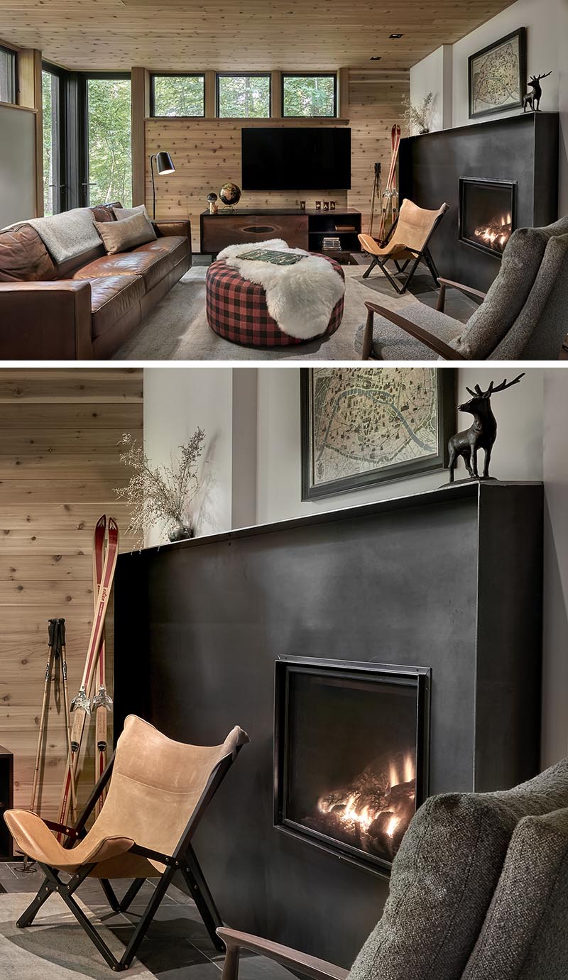 A hand-worked blackened steel fireplace surround commands attention in this cozy living room. #SteelFireplaceSurround #BlackSteelFireplace #FireplaceDesign #FireplaceSurround