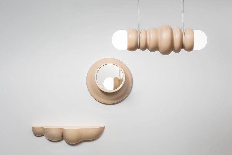 Studio Sain has collaborated with woodturner Hermann Viehhauser to create Bulbous, a collection of modern home decor items that include a shelf, a mirror, a hanging lamp, and a table lamp, some with movable parts. #Design #LightingDesign #WoodDecor #WoodLighting #ModernDecor