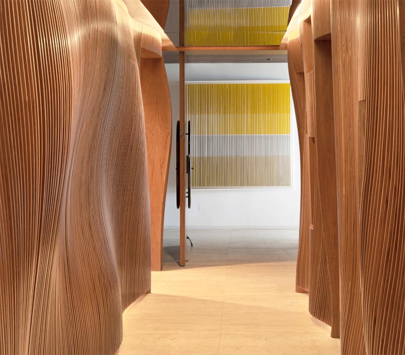 A Wavy Sculptural Hallway Greets Guests As They Arrive At This Apartment