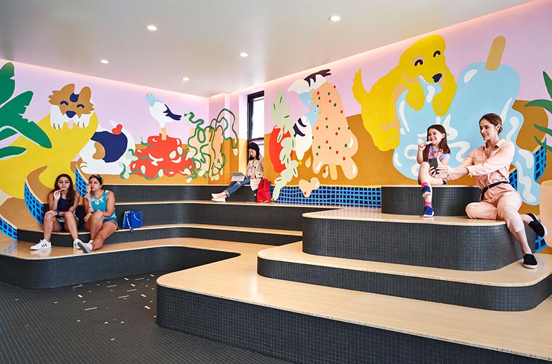 In the recently completed Pretty Cool Ice Cream Shop in Chicago, Illinois, Tumu Studio created a sculptural tiered seating element for visitors of the shop to relax on. #TieredSeating #RetailDesign #IceCreamShop #InteriorDesign