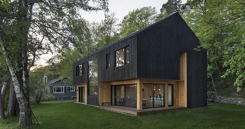 Black Charred Wood Siding Creates A Bold Look For This Lakeside Home