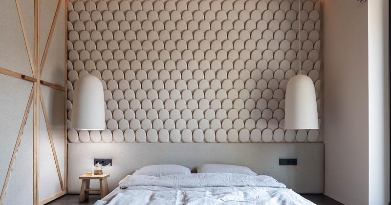 An Eye-Catching Bedroom Accent Wall Made From Rows Of Stone-Like Pieces