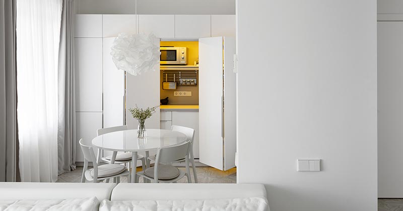 The Kitchen In This Small Apartment Is Hidden In A Closet