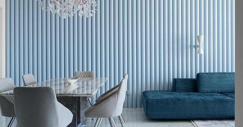 A Light Blue Ribbed Accent Wall Adds A Soft Texture To This Living Room