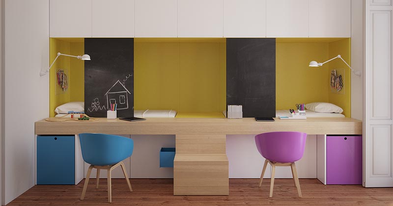 The Beds In This Kids Bedroom Are Built Into The Wall Behind The Desks