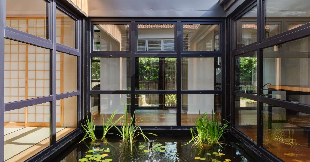 Step inside this Japanese&inspired home extension that's wrapped around a reflection pool