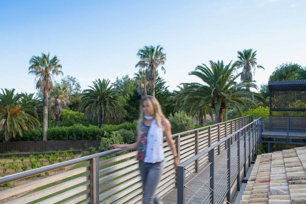 This home has a outdoor walkway connecting various parts of the home.