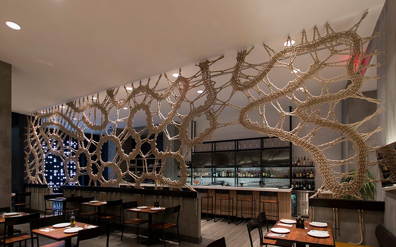 MANTZALIN have designed a rope screen for Stix, a new Mediterranean restaurant in Chelsea, New York. #RopeScreen #RestaurantDesign #RestaurantInterior #Rope #InteriorDesign