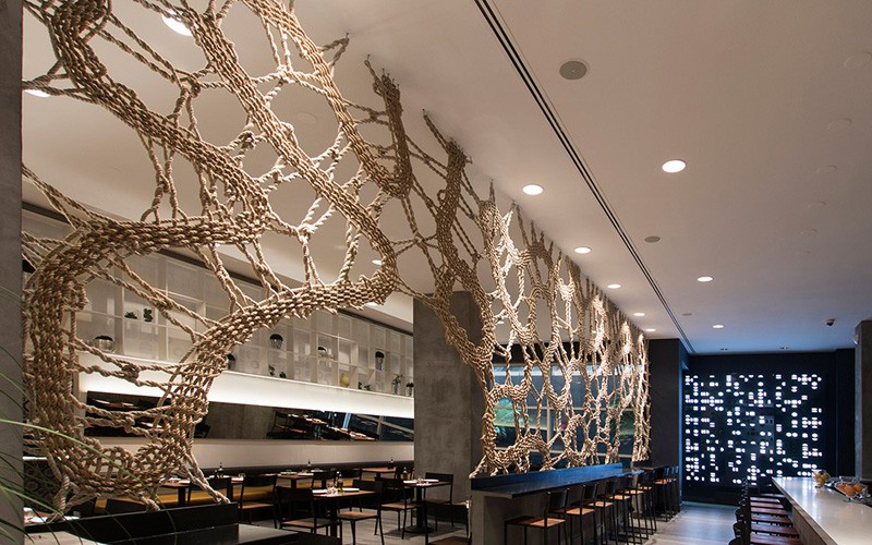 MANTZALIN have designed a rope screen for Stix, a new Mediterranean restaurant in Chelsea, New York. #RopeScreen #RestaurantDesign #RestaurantInterior #Rope #InteriorDesign