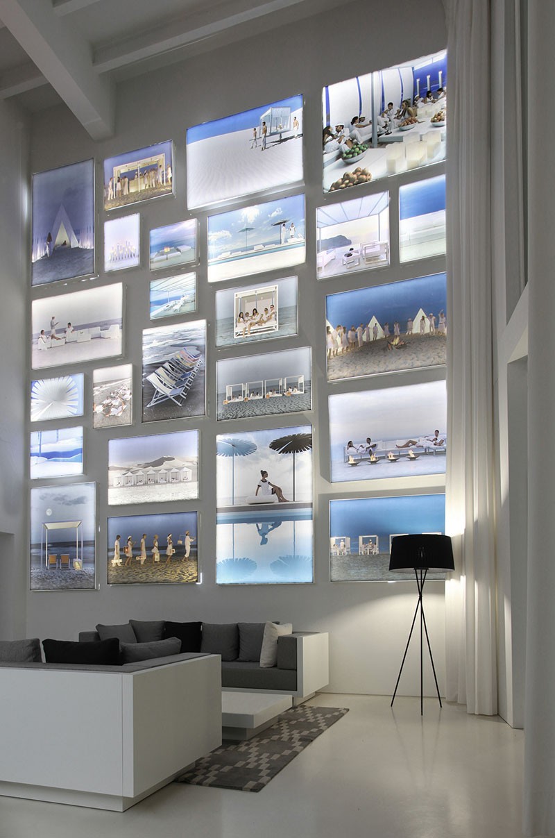 A Wall Of Illuminated Backlit Photos