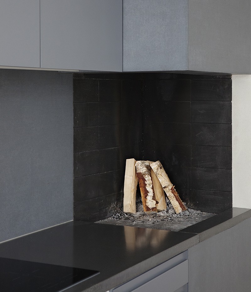 Open Wood-Burning Fireplace In A Kitchen