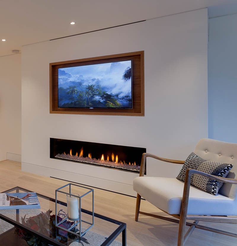 Recessed TV above fireplace