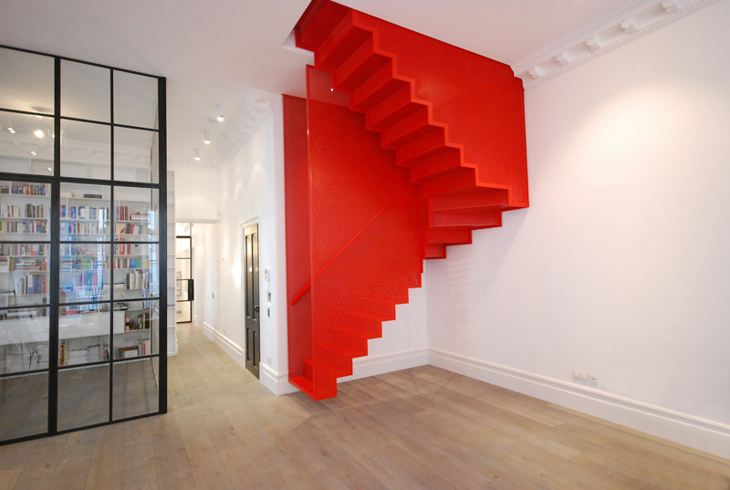 Hanging Red Stairs by Michaelis Boyd Associates