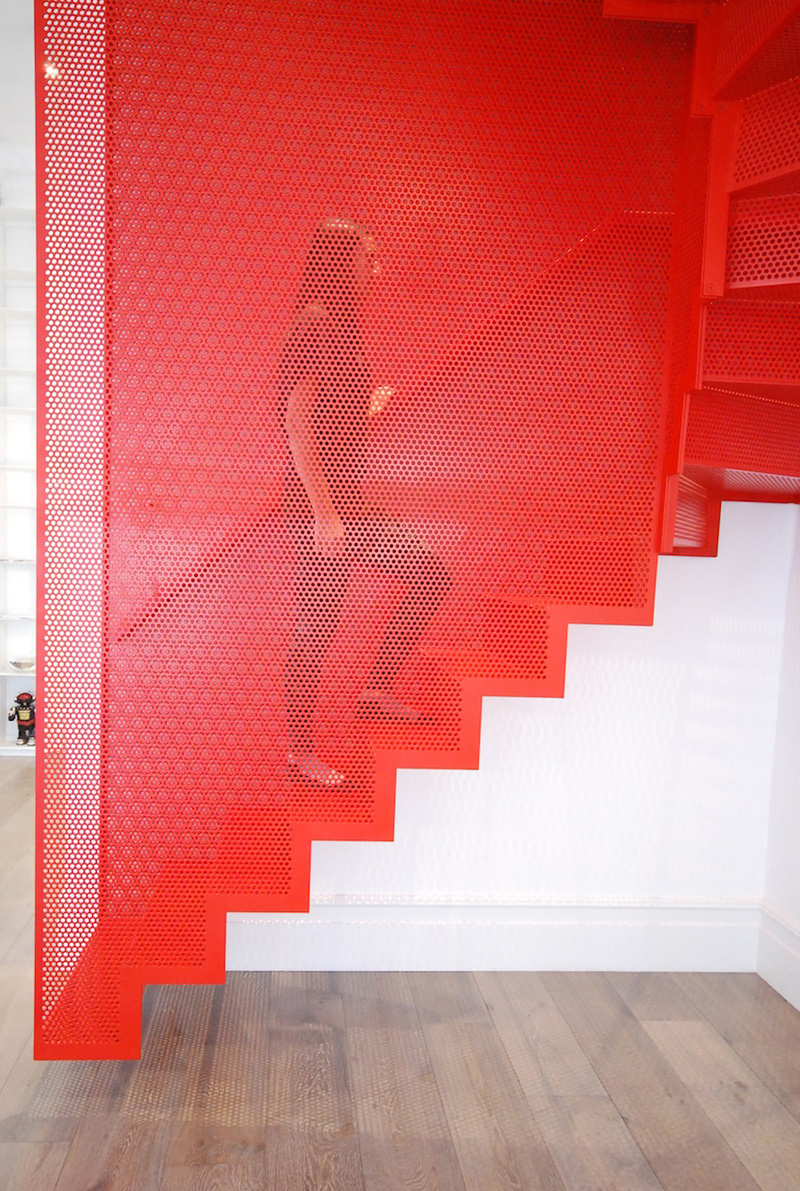 Hanging Red Stairs by Michaelis Boyd Associates