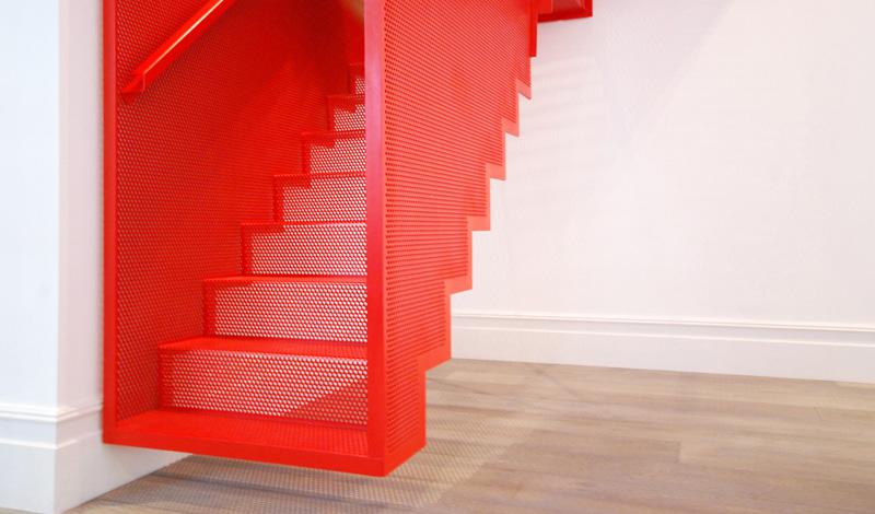 Hanging Red Stairs by Michaelis Boyd Associates