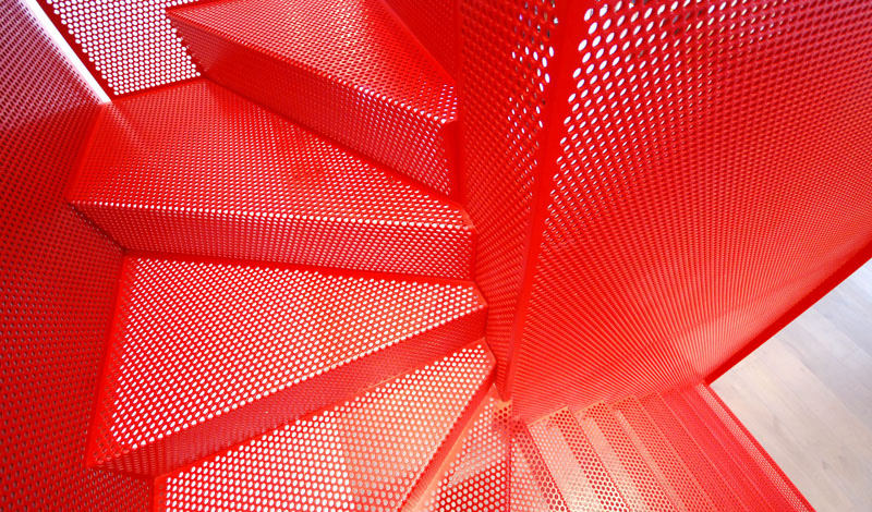 Hanging Red Stairs by Michaelis Boyd Associates