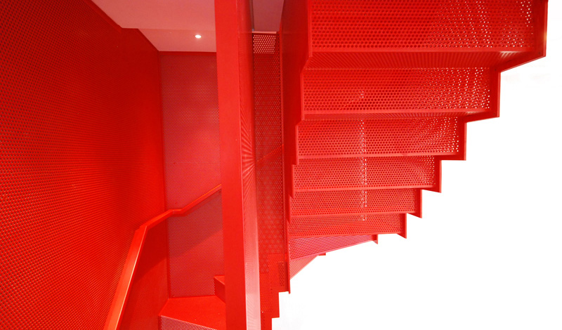 Hanging Red Stairs by Michaelis Boyd Associates