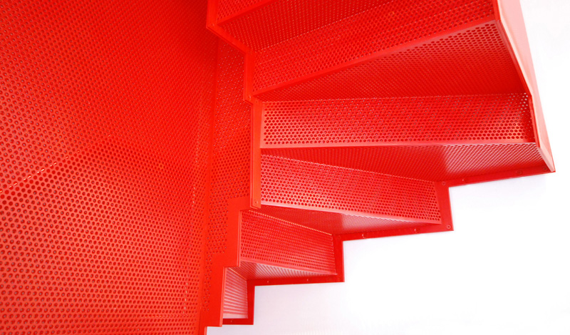 Hanging Red Stairs by Michaelis Boyd Associates