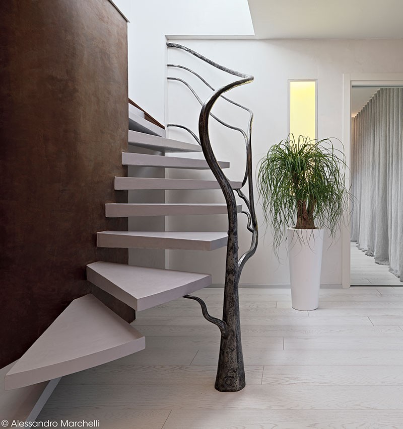 Tree-Like Sculpture Acts As A Railing For These Stairs